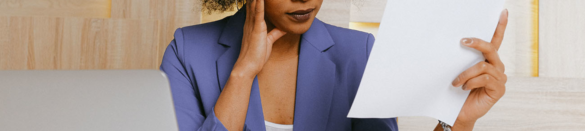 Canva   Woman In Blue Blazer Holding White Paper Small 