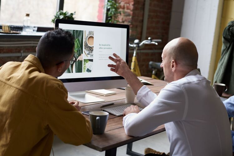 Canva Men Using Imac Indoors Small