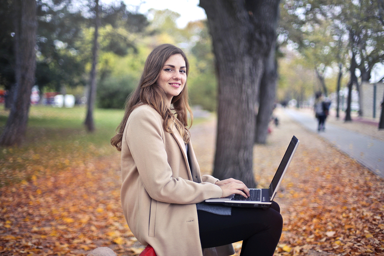 Canva Joyful Confident Woman Using Netbook In Park Blog